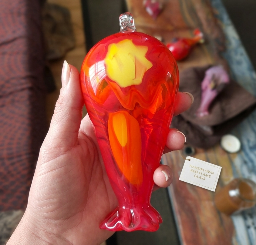 Hand-blown glass hummingbird feeder in red and orange